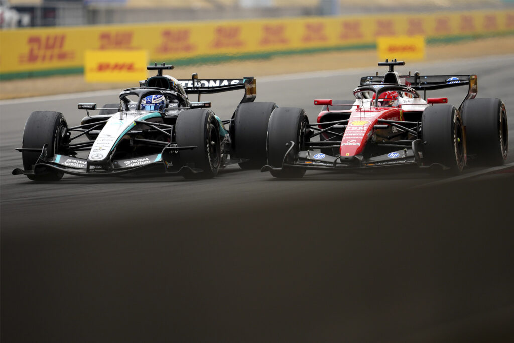George Russell of Great Britain driving the (63) Mercedes AMG Petronas F1 Team W17 and Charles Leclerc of Monaco driving the (16) Scuderia Ferrari SF-26 battle for track position during the F1 Grand Prix of China at Shanghai International Circuit on March 15