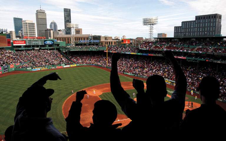 April 14, 2024, Boston, MA: A general view of Fenway Park from 3rd base line as fans celebrate as silhouettes in the foreground at Fenway Park in Boston, Massachusetts Sunday, April 14, 2024. (Photo by Eddie Monigan/Boston Red Sox)