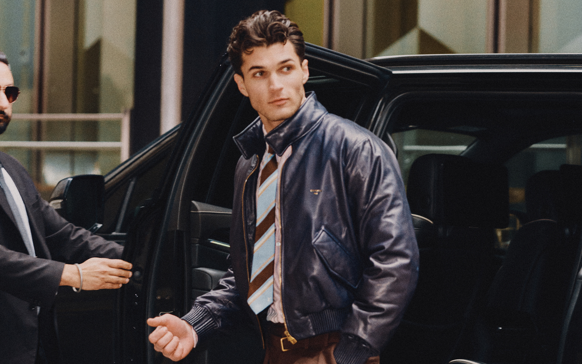 ACKET ($9,350), SHIRT ($1,900), TIE ($350), PANTS ($2,220), AND SHOES ($1,570) BY LOUIS VUITTON MEN’S.