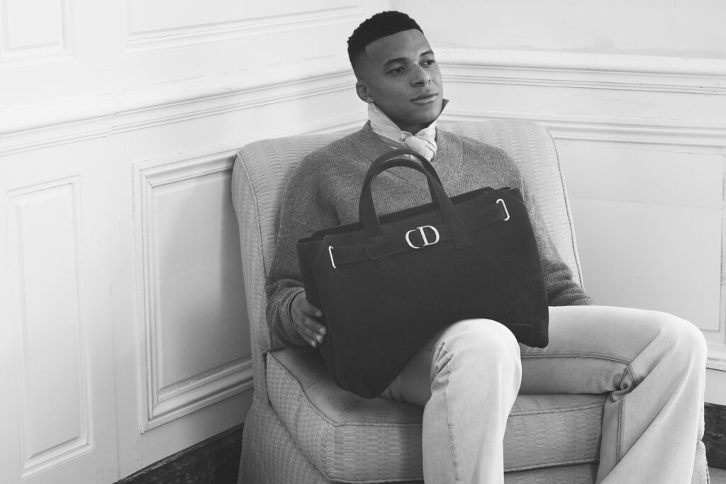 KYLIAN MBAPPÉ. SWEATER, AND BAG BY DIOR; PHOTOGRAPHY BY DAVID SIMS.