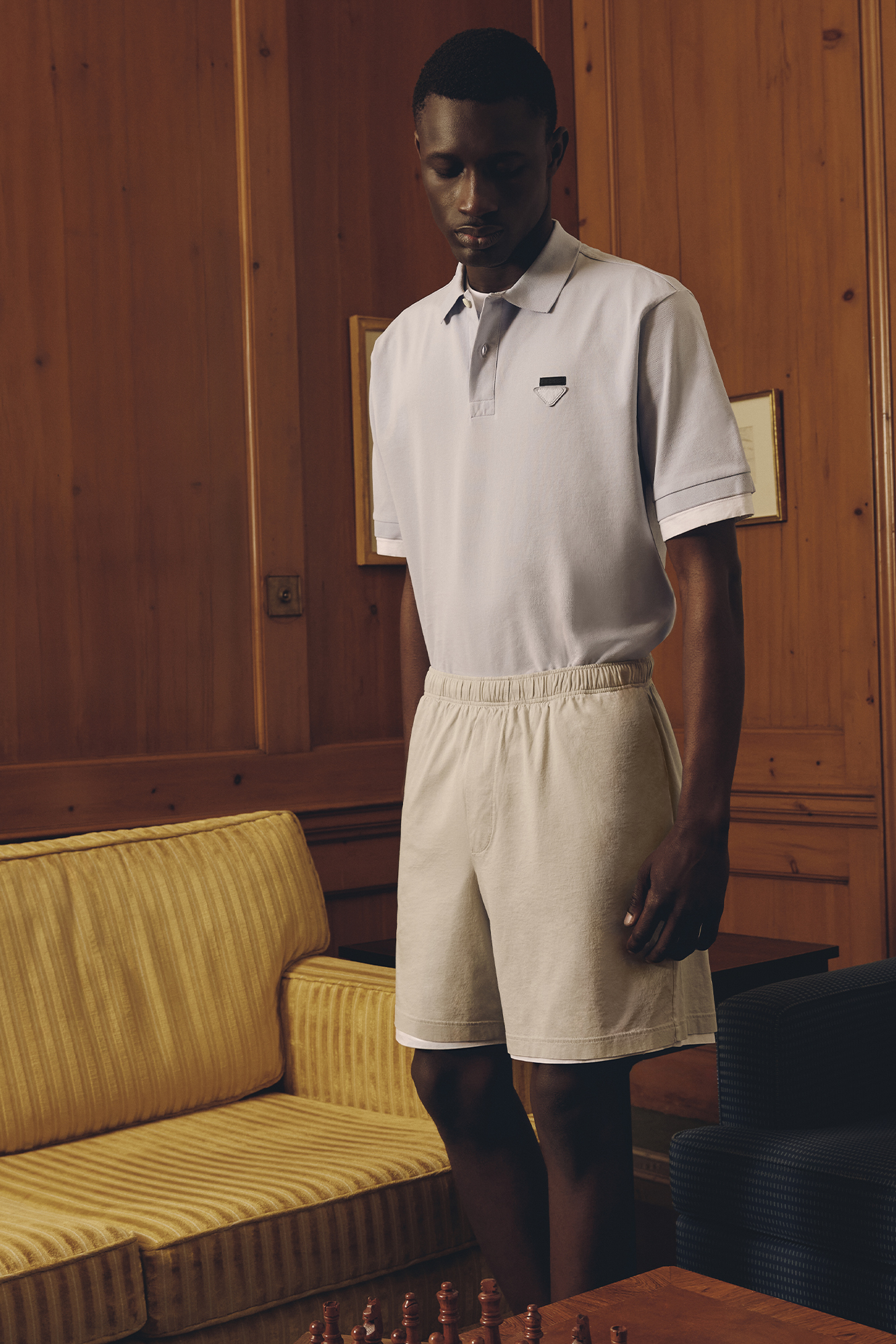 SHIRT ($1,690), SHORTS ($1,520), AND SHOES ($1,750) BY PRADA.