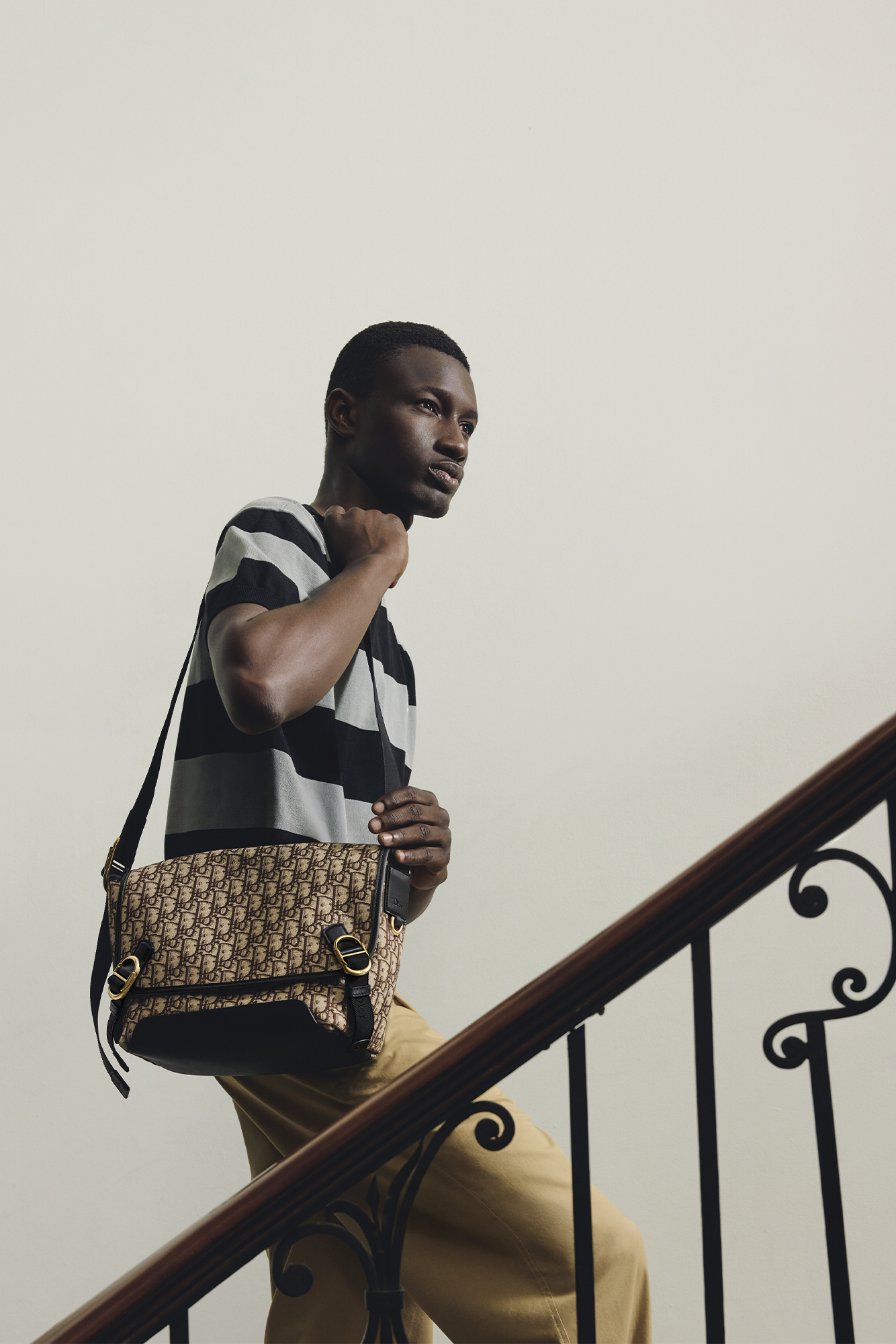 TORONTO. SHIRT ($1,850), PANTS ($1,550), SHOES ($1,600), AND BAG ($4,300) BY DIOR.
