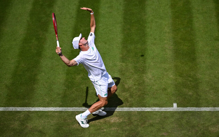 LONDON, ENGLAND - JUNE 29: Tommy Paul of the United States in action against Alexandre Muller of France during the Gentlemen's Singles first round match on Day One of The Championships Wimbledon 2026 at All England Lawn Tennis and Croquet Club on June 29, 2026 in London, England. (Photo by Daniel Kopatsch/Getty Images)