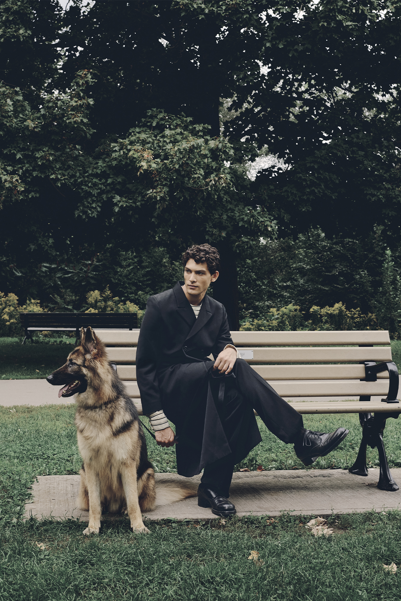 JACKET ($6,000), SHIRT ($3,650), PANTS ($2,650), SOCKS ($220), AND SHOES ($2,300) BY PRADA.
